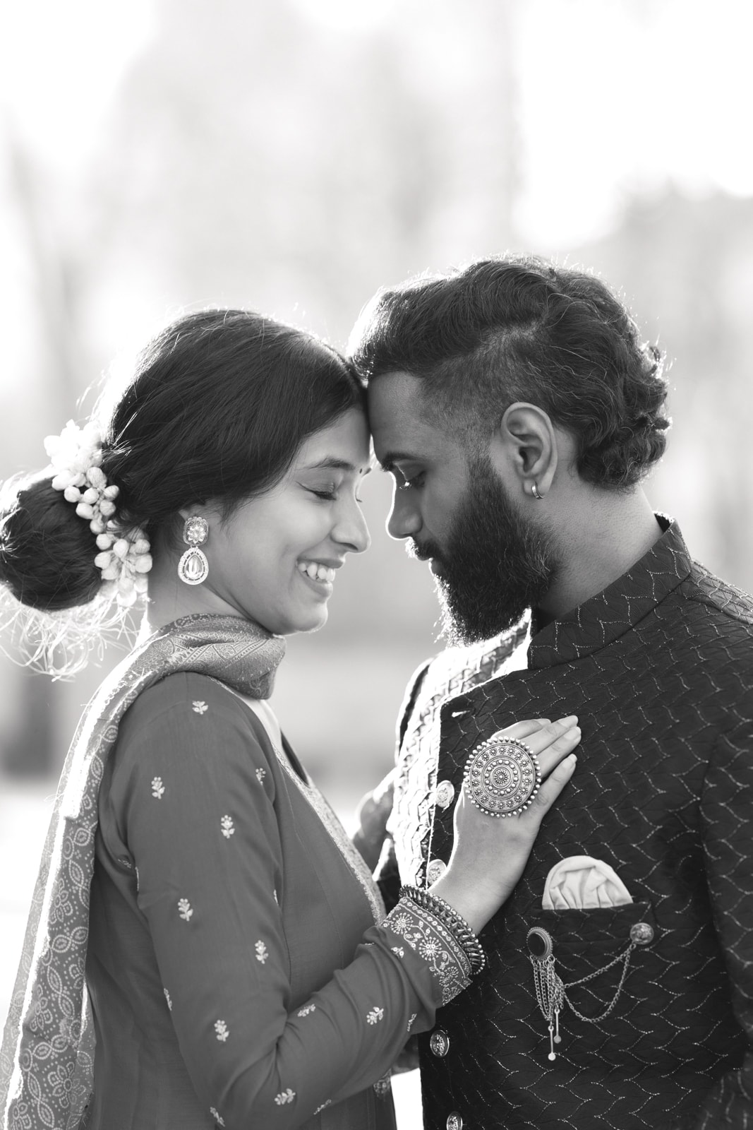 Modern portrait of Indian bridal couple in urban park ambiance